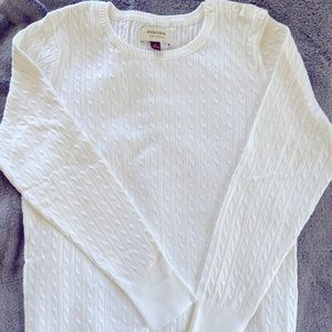 Woman’s white sweater
